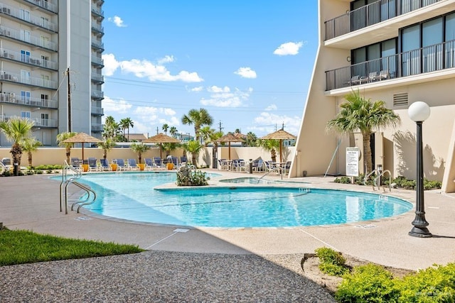 view of swimming pool featuring a patio area