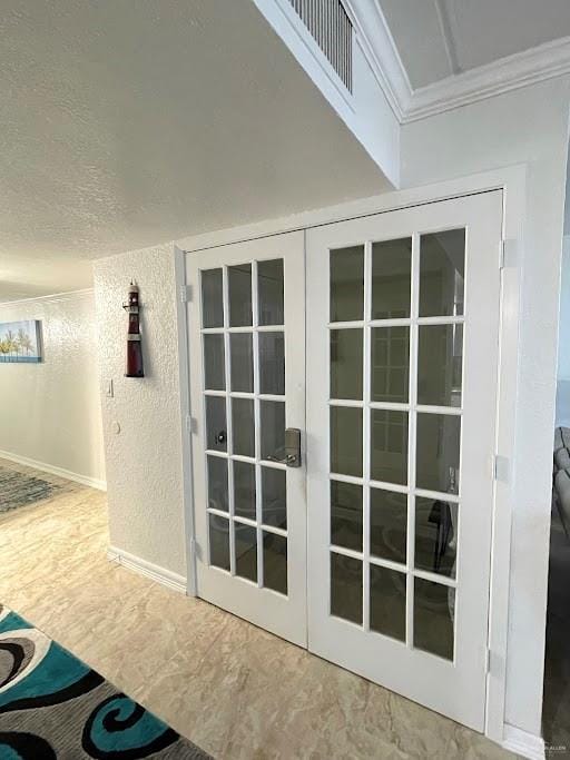 interior space featuring french doors and ornamental molding