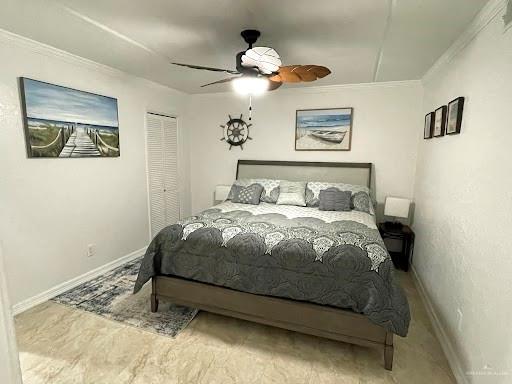 bedroom featuring ceiling fan, a closet, and ornamental molding