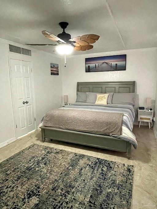 bedroom with ceiling fan and crown molding