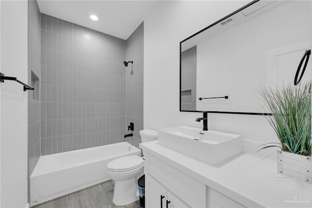 2117 Zinnia St, Weslaco, TX 78596 - bathroom with vanity, shower / tub combination, and wood finished floors