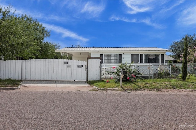 421 W Champion St, Edinburg, TX 78539 - view of front facade with a fenced front yard and a gate