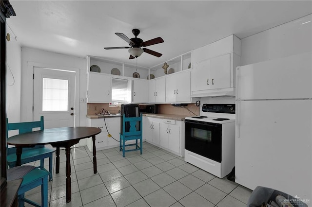 421 W Champion St, Edinburg, TX 78539 - kitchen with freestanding refrigerator, range with electric cooktop, white cabinetry, and ceiling fan