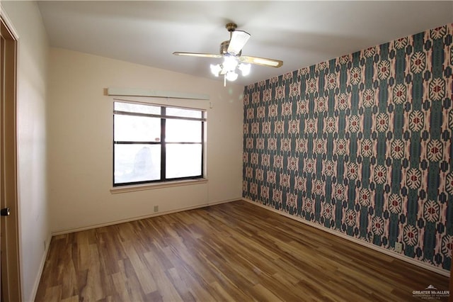 unfurnished room featuring ceiling fan and hardwood / wood-style floors