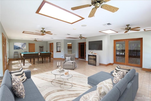 living room with light tile patterned flooring, french doors, and pool table