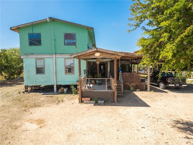 back of house with a porch