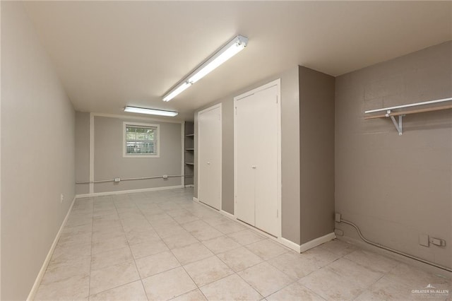 1821 Palm Blvd, Brownsville, TX 78520 - unfurnished bedroom featuring light tile patterned floors and two closets