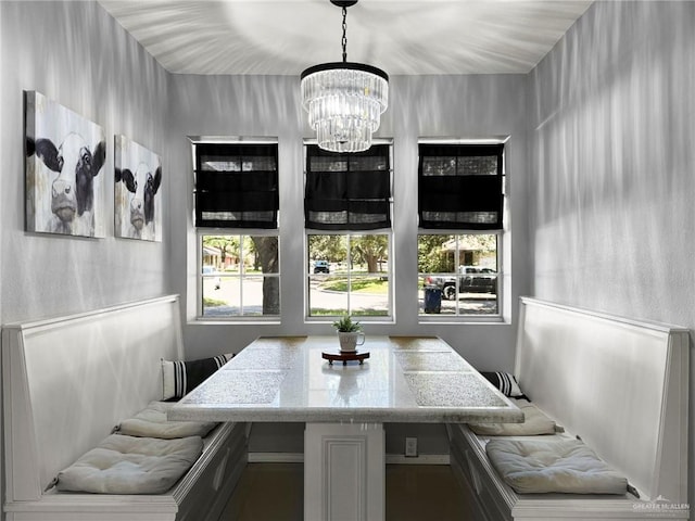 dining room featuring breakfast area and an inviting chandelier