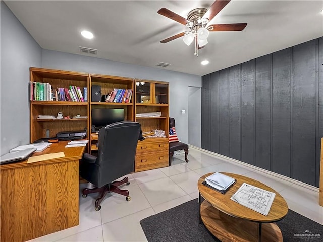 tiled home office featuring ceiling fan