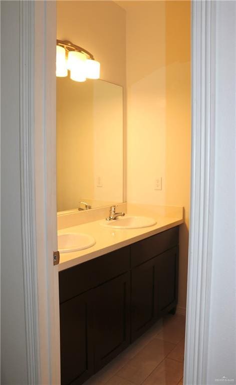 bathroom with tile patterned flooring and vanity