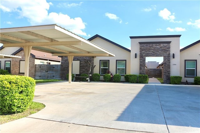 view of front of home with a carport