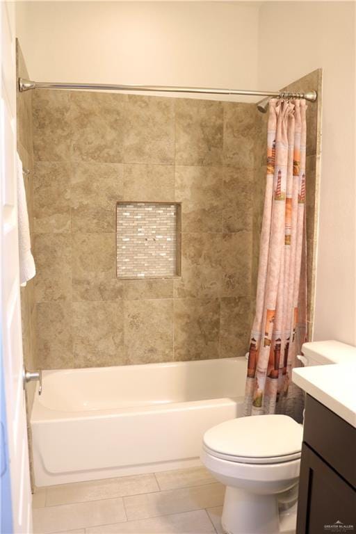 full bathroom featuring vanity, tile patterned floors, toilet, and shower / bathtub combination with curtain