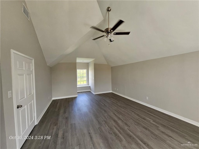 additional living space featuring ceiling fan, dark hardwood / wood-style flooring, and vaulted ceiling