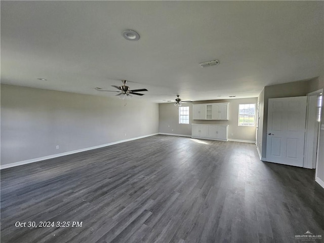 27406 S Kelly Ct, La Feria, TX 78559 - unfurnished living room with a ceiling fan and dark wood-style floors