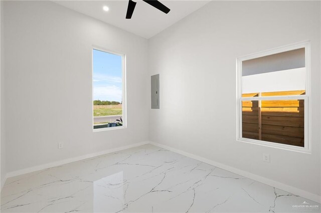 unfurnished room featuring electric panel and ceiling fan