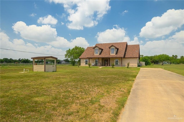 24162 N Tamm Ln, Harlingen, TX 78552 - cape cod home featuring a front lawn