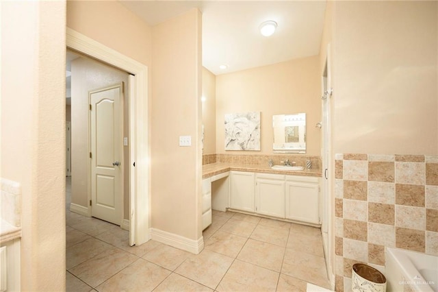24162 N Tamm Ln, Harlingen, TX 78552 - bathroom featuring tile patterned floors, vanity, and a bath
