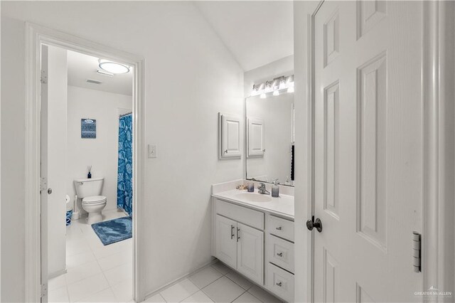 bathroom with tile patterned floors, vanity, toilet, and a shower with shower curtain