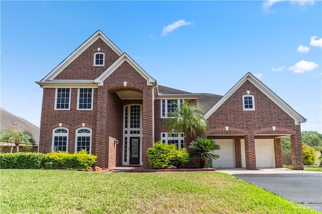 front of property featuring a front lawn and a garage