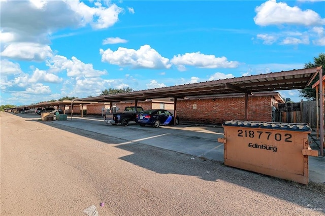 view of parking / parking lot featuring a carport