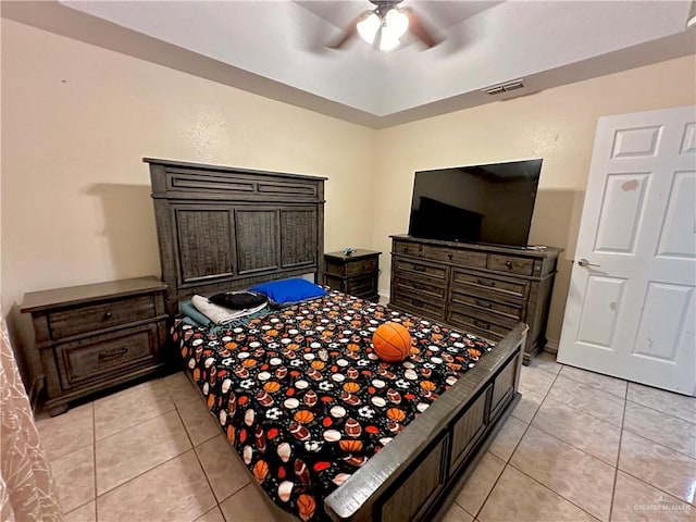 bedroom with ceiling fan and light tile patterned floors