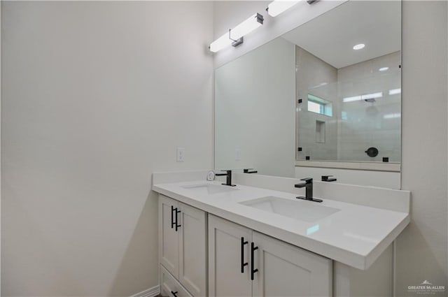 bathroom with vanity and a shower with door