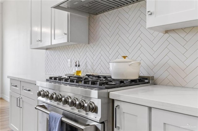 1405 Jocelyn Cir, Harlingen, TX 78552 - kitchen featuring high end stainless steel range oven, decorative backsplash, custom range hood, and light countertops