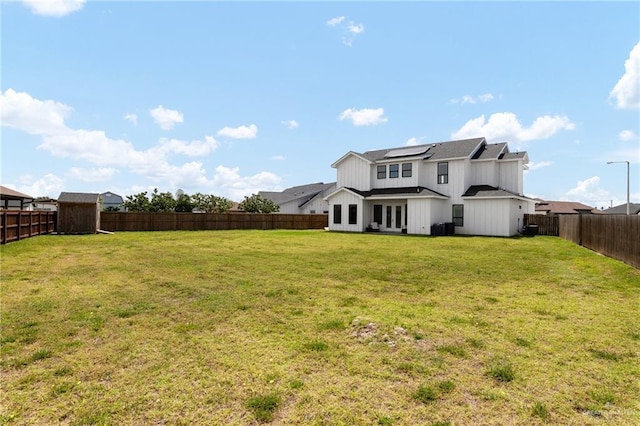 1405 Jocelyn Cir, Harlingen, TX 78552 - view of yard featuring a fenced backyard and french doors