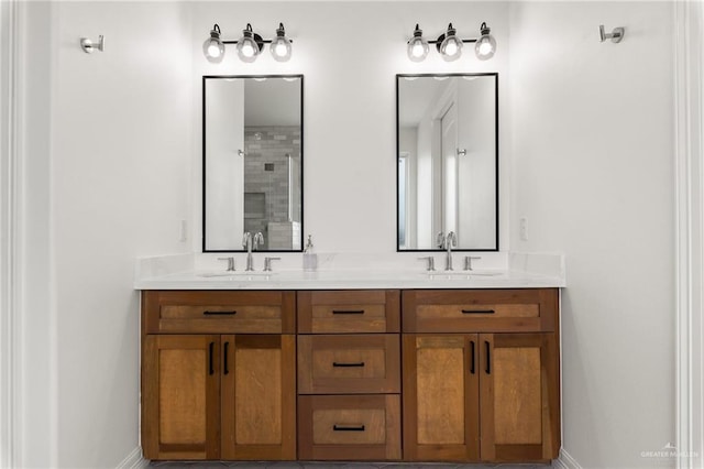 1405 Jocelyn Cir, Harlingen, TX 78552 - full bathroom featuring double vanity, baseboards, tiled shower, and a sink