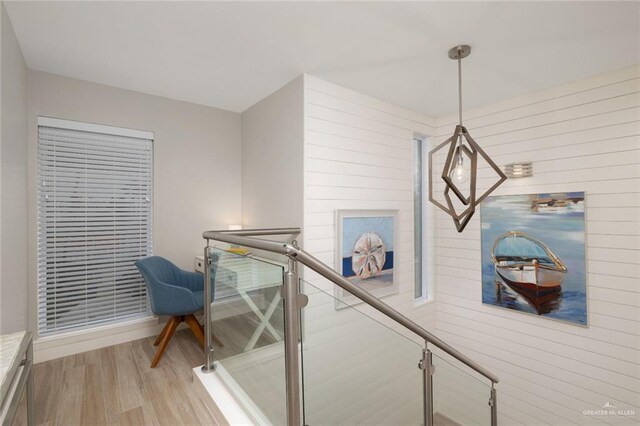 stairs with hardwood / wood-style flooring