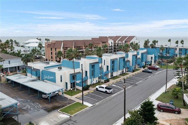 birds eye view of property with a water view