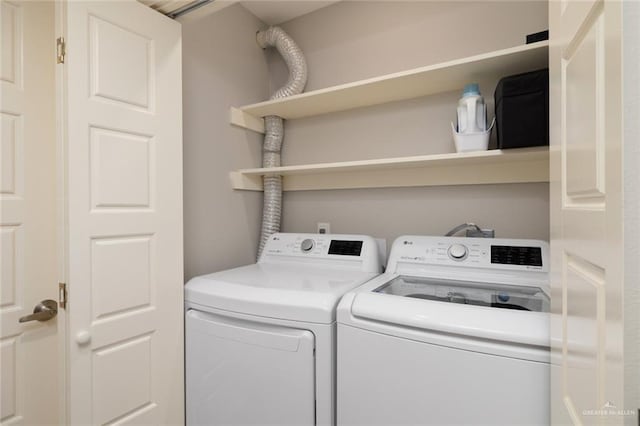 laundry room featuring separate washer and dryer