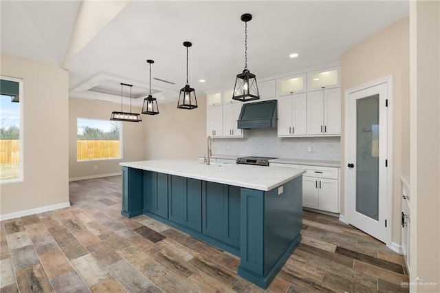 kitchen featuring electric stove, custom range hood, backsplash, white cabinetry, and wood finished floors