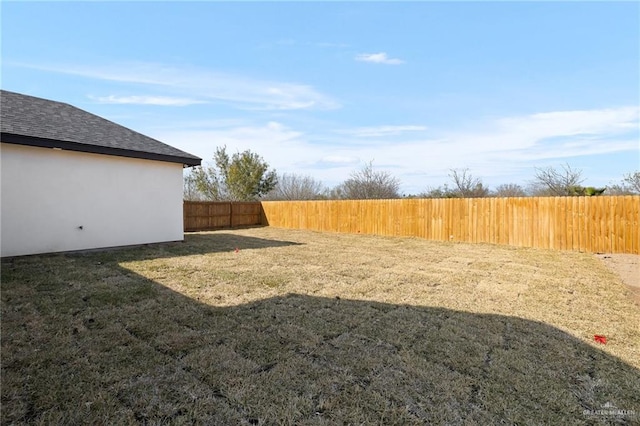 view of yard with a fenced backyard