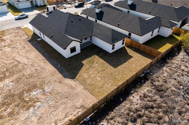 birds eye view of property with a residential view