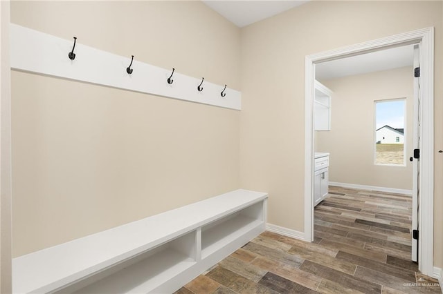 mudroom with light wood-type flooring and baseboards