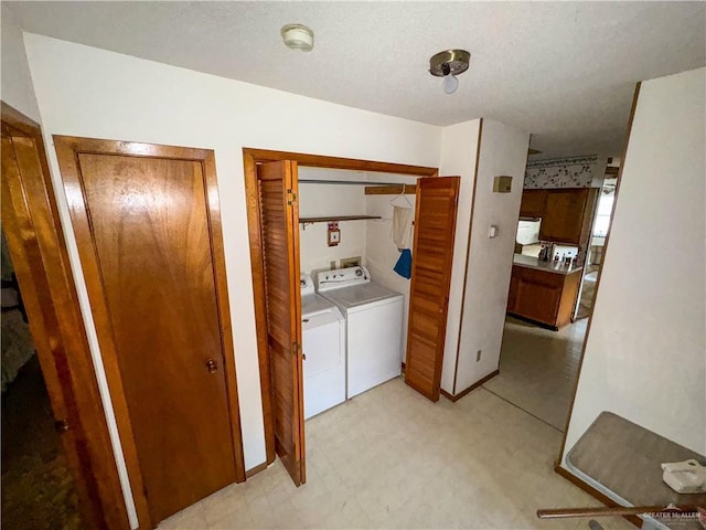 laundry room with separate washer and dryer