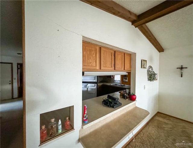 kitchen with lofted ceiling with beams