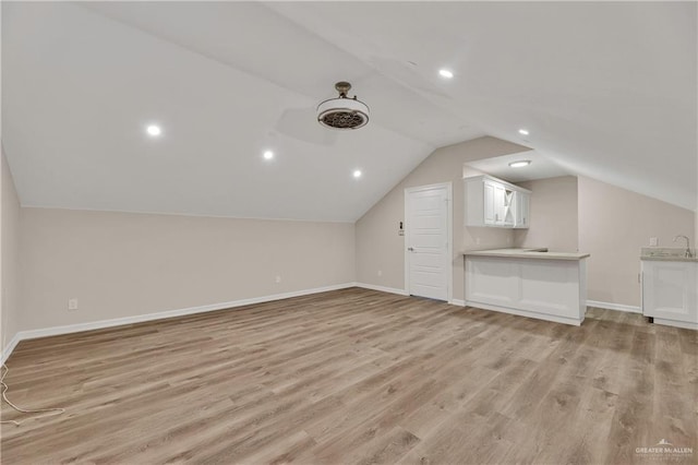 bonus room with recessed lighting, baseboards, vaulted ceiling, and light wood finished floors