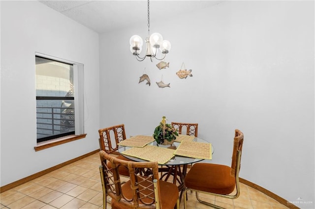 tiled dining space featuring a chandelier