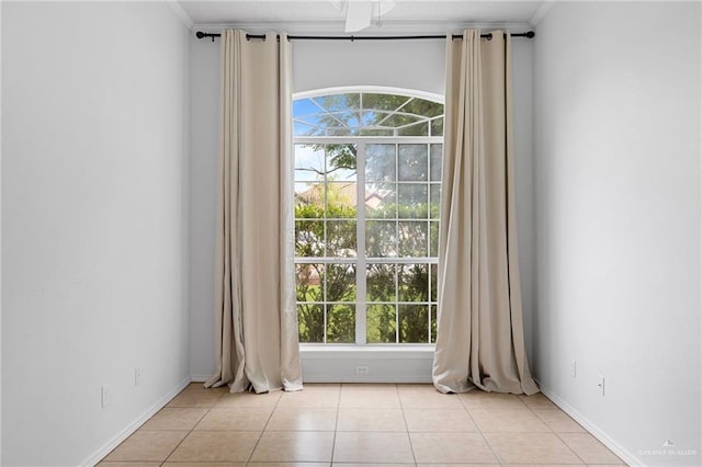 2706 E 28th St, Mission, TX 78574 - unfurnished room with light tile patterned floors, plenty of natural light, and baseboards
