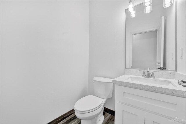 2501 Linva Ave, Mcallen, TX 78541 - half bath with wood finished floors, toilet, and vanity