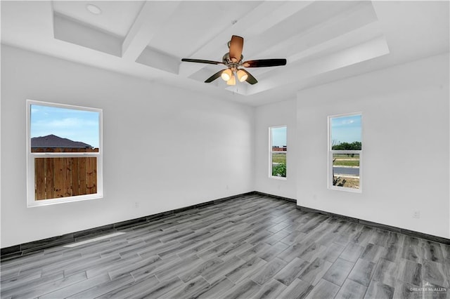 2501 Linva Ave, Mcallen, TX 78541 - empty room with a ceiling fan, a tray ceiling, wood finished floors, and baseboards