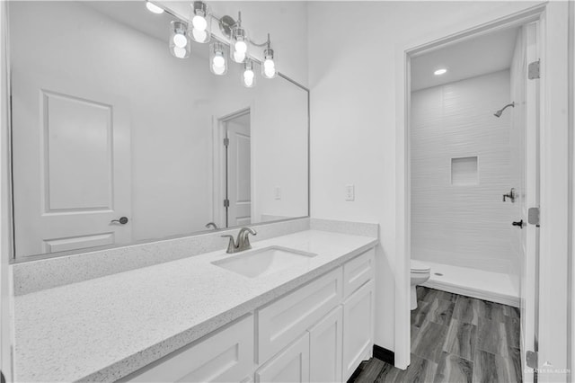 2501 Linva Ave, Mcallen, TX 78541 - full bath with a shower, toilet, recessed lighting, wood finished floors, and vanity