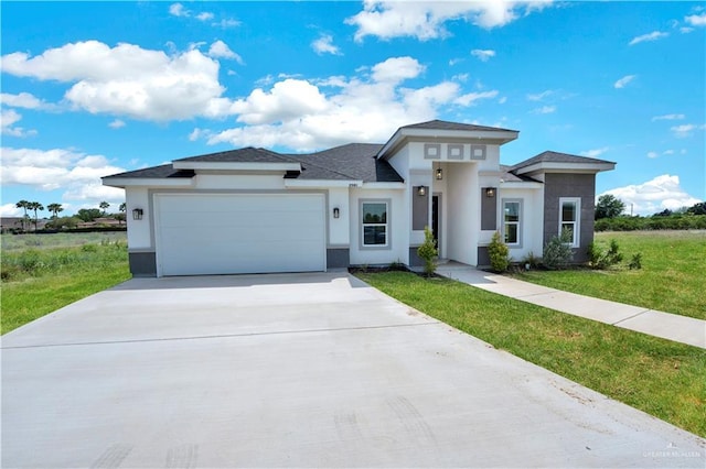 2501 Linva Ave, Mcallen, TX 78541 - prairie-style house featuring a front yard, driveway, a garage, and stucco siding