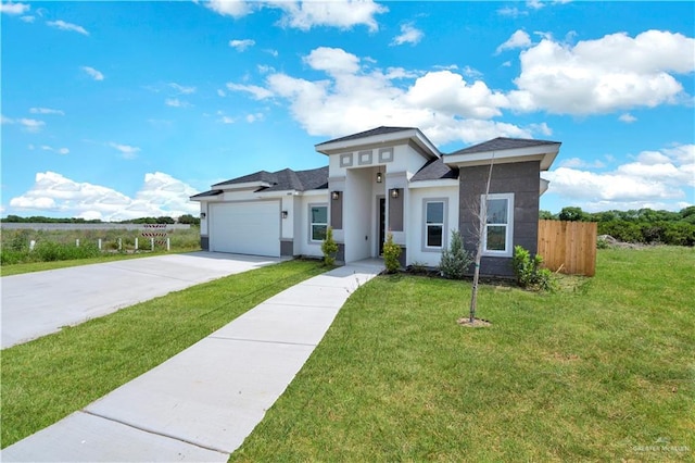 2501 Linva Ave, Mcallen, TX 78541 - prairie-style house with driveway, fence, stucco siding, a front lawn, and a garage
