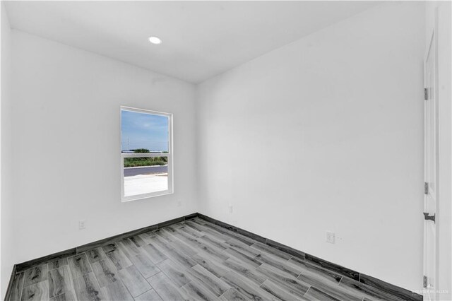 2501 Linva Ave, Mcallen, TX 78541 - unfurnished room with recessed lighting, baseboards, and light wood-type flooring