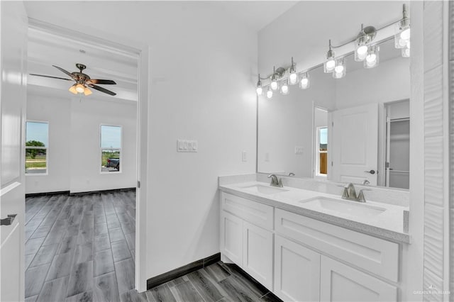 2501 Linva Ave, Mcallen, TX 78541 - bathroom with a ceiling fan, a sink, double vanity, and wood finished floors