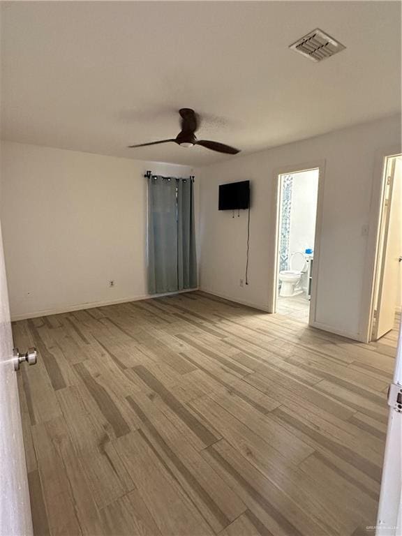 unfurnished room with ceiling fan and light wood-type flooring