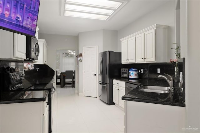 3500 Santa Lucia Cir, Mission, TX 78572 - kitchen featuring black appliances, a sink, white cabinets, tasteful backsplash, and light tile patterned floors